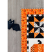 A close-up image of a Too Cute to Spook Wall Hanging border next to a plush bat..