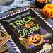 The October Chalk it Up wall hanging laid flat on a table with Halloween decor