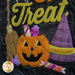 Wool applique featuring a smiling Jack-o-lantern, the word Treat, candy, a witches hat, and broom against a black wool background