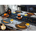 table set with halloween theme featuring four witch hat shaped placemats