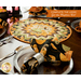 Folded star table topper with whimsical halloween prints in orange, cream, and green.