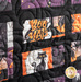 A close up of solid black borders around colorful Halloween fabrics