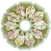 10 sided folded wreath being used as table topper made of green and purple floral fabrics.