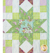 Close up of sawtooth star and checker design in pastel green and purple fabrics.