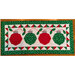 Isolated image of finished  table runner on a white background. Table runner features four red and green ornaments with holly leaves and a decorative border
