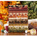 Image of all fat quarters included in set staged among fall foliage and thread spools on a table