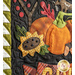 Close up of wall hanging appliqué featuring a sunflower and a pumpkin.