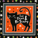 close-up scan of orange panel square fabric containing a black cat, black and white stars, and a halloween saying, surrounded by colorful stars on a black background