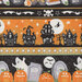 close up image of border stripe fabric with ghosts, jack-o-lanterns, graves and skeletons