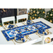 Christmas themed table runner featuring bell designs made of blue and cream snowflake fabrics.