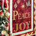 Christmas Joy Quilt Kit featuring the words Love, Peace, and Joy on red and gold fabric.