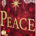 Christmas Joy Quilt Kit featuring the word Peace on red and gold fabric.