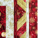 Christmas Joy Quilt Kit border featuring red, gold, and white snowflake fabrics.