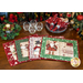 Four festive Christmas placemats lay on a wooden table, surrounded by decorations and glassware.