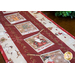 A festive table runner featuring seasonal images like Santa, snowmen, and holiday décor.