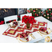 Table runner with strips of fabric in a lattice design made from metallic red and cream Christmas and snowflake printed fabrics.