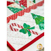 Christmas tree and candy cane appliqué on white table runner. 