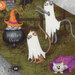 A close up of the Halloween panel showing cats dressed as ghosts, wearing hats, and sitting in cauldrons