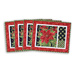 Placemats with silverware pocket made of poinsettia and green bow fabric.
