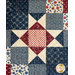 Close up of quilt block with an Ohio star and patchwork design.