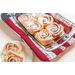 A detail shot of an Americana Casserole Hot Pad with cinnamon rolls.
