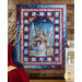 Panel quilt of a winter scene including a snowy cabin, a snowman, and a small deer.