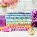 A stack of fabrics included in the Summer Breeze fabric collection by In The Beginning Fabrics