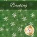 A swatch of green fabric with white and dark green scattered snowflakes. A dark green banner at the top reads 