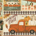 A patchwork fabric featuring vintage trucks, pumpkins, bird houses, birds, and autumn wreathes