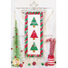 Small quilt with three pine trees in green, red, and white fabrics hanging from a star shaped craft holder.