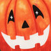 A close up of a fabric panel showing a smiling jack-o-lanterns face