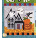 Quilt block featuring a dark halloween decorated house with jack-o-lanterns.