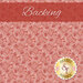 A swatch of pink fabric with red and white square outlines tossed all over with small red daisies and dots. A rust red banner at the top reads 
