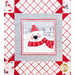 Close up of a block featuring a polar bear wearing a red scarf and hat with a gray border