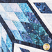 Close up of a gradient of blue diamond pieces in the center of the quilt design