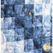 close up of blue and white fabrics that fade into a gradient on either side of a dark blue line