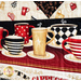 Close up image of border fabric and quilting featuring rows of steaming coffee mugs with geometric designs