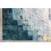 close up of corner of farmhouse cross quilt showing teal fabrics fading into cream
