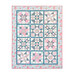 A patchwork quilt with classic quilt star blocks in soft blue, pink, and cream isolated on a white background