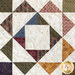 Close up of a single quilt block from the Aunt Dinah quilt featuring a geometric pattern made with neutral fabrics.