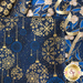 Close up of dark blue fabric with metallic gold winter motifs layered atop one another with a spiraled gold ribbon laying on top and to the right.