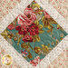 Close up photo of one quilt block showing a diamond pattern made with teal and cream floral fabrics from the Primrose collection