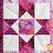 Close up of an Ohio star quilt block made with pink, purple and white fabrics from the Dragonfly Dreams fabric collection