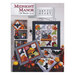 Scan of the front of the Midnight Manor block pattern book, showing the finished quilt and additional finished projects