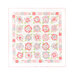 Cream quilt with abstract roses all over made of layered pink fabrics with a square patchwork border isolated on a white background