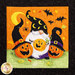 Close up of a quilt block showing a gnome with jack-o-lanterns wearing pointed witch hats