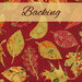 Bright red fabric featuring metallic swirls and yellow and red stylized leaves tossed in the foreground with a light yellow banner at the top with the word 