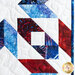 close up of block detail on the patriotic quilt made with batik fabrics in red, white, and blue in a geometric pattern