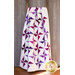 Draped quilt with white background fabric and purple pinwheels on wood ladder