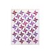 Straight on image of white quilt and purple and gray pinwheels